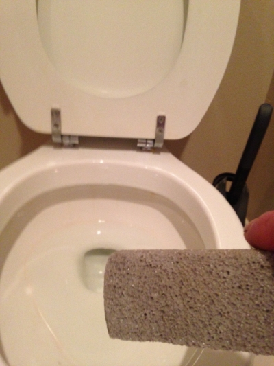 Use a pumice to gently remove the toilet ring