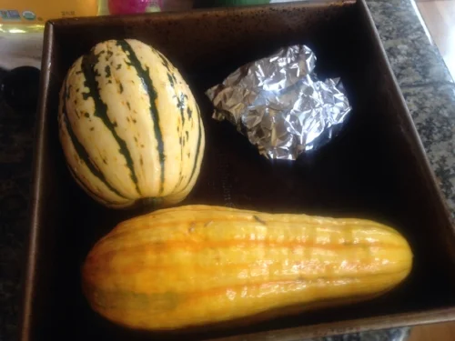Roast the squash whole since they are tough to cut raw. You can add the garlic bulb in foil to the same pan for easier clean up. Just remember to set the timer for approx. 30 minutes to pull out the garlic bulb before it burns. Clean out squash seeds after it cools, dice, and add to the mix.