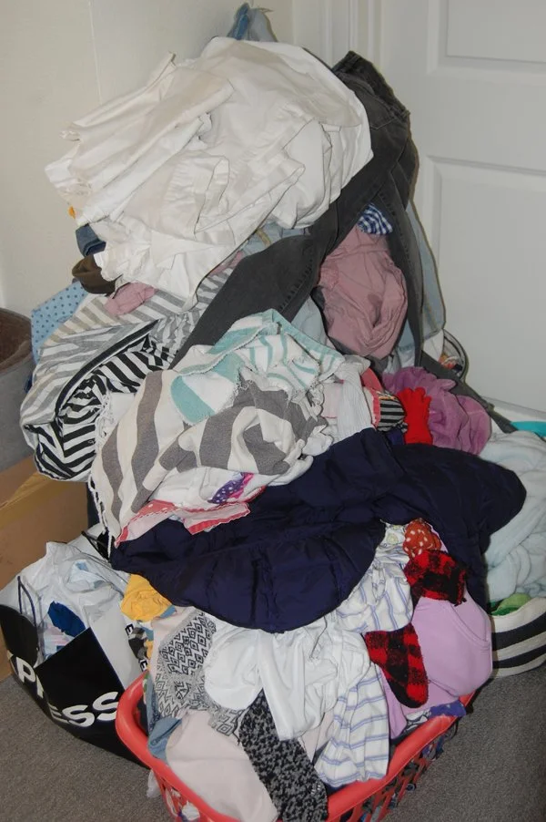 laundry pile fill the hallway