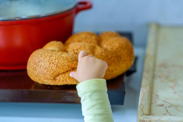 Young Child Pinching Challah.jpg