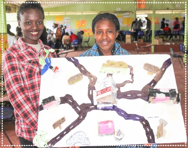 (Faith and Winnie displaying their prototype in an Entrepreneurship session)