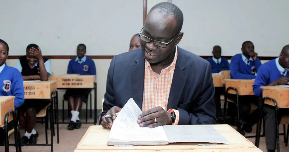 Okoth with students in Raila Education Centre High School- Kibera