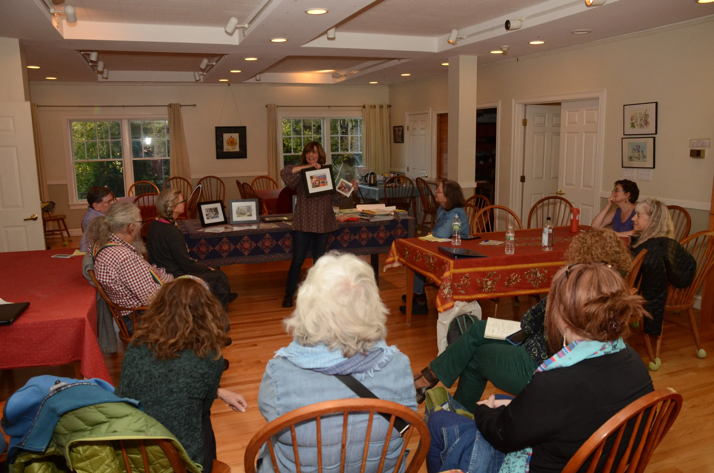 I show examples of my work. (Photo by John Heymann)