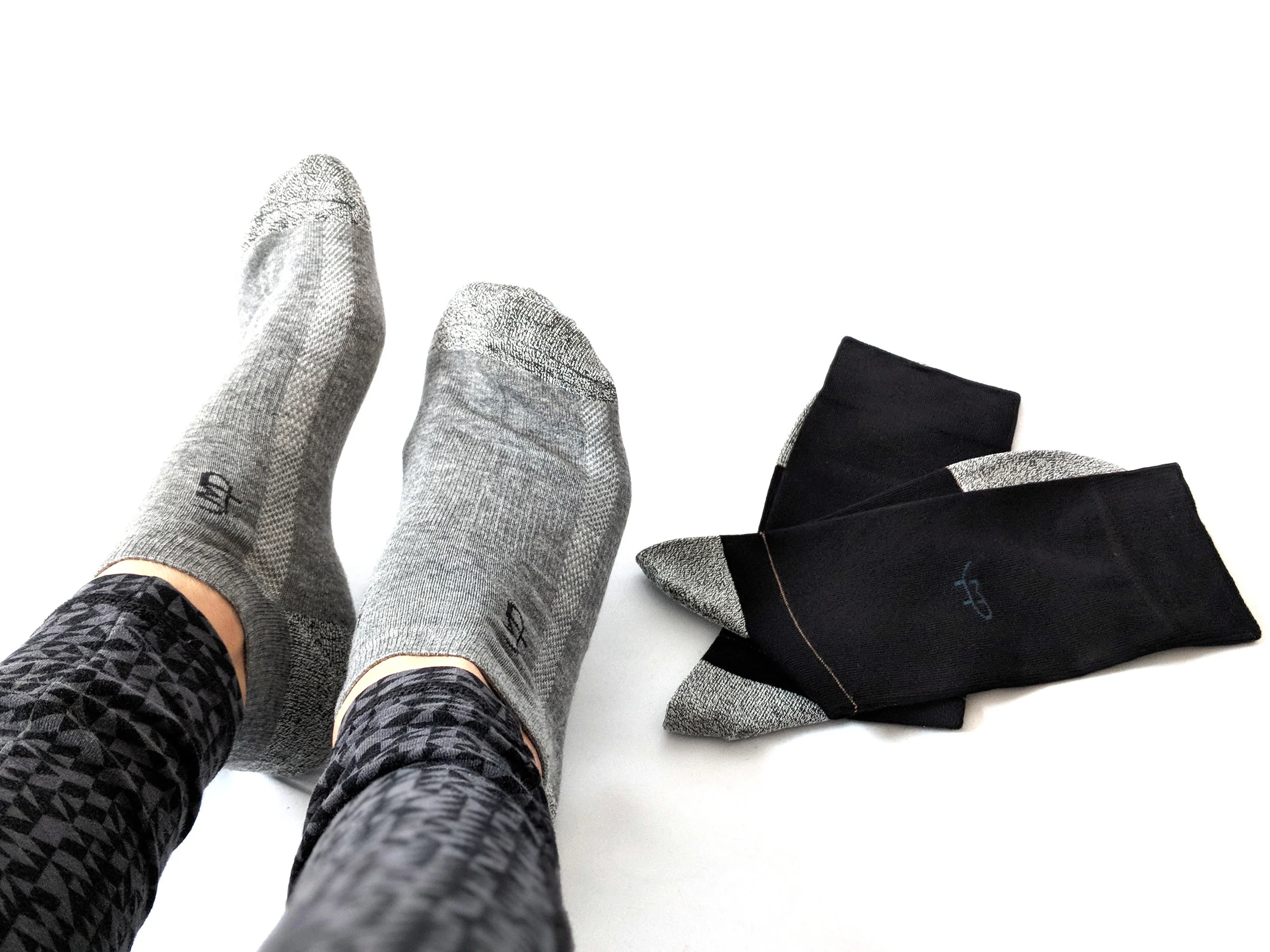 Wearing the grey ankle socks and flat lay of the black crew socks - Photo Credit: The Sock Review