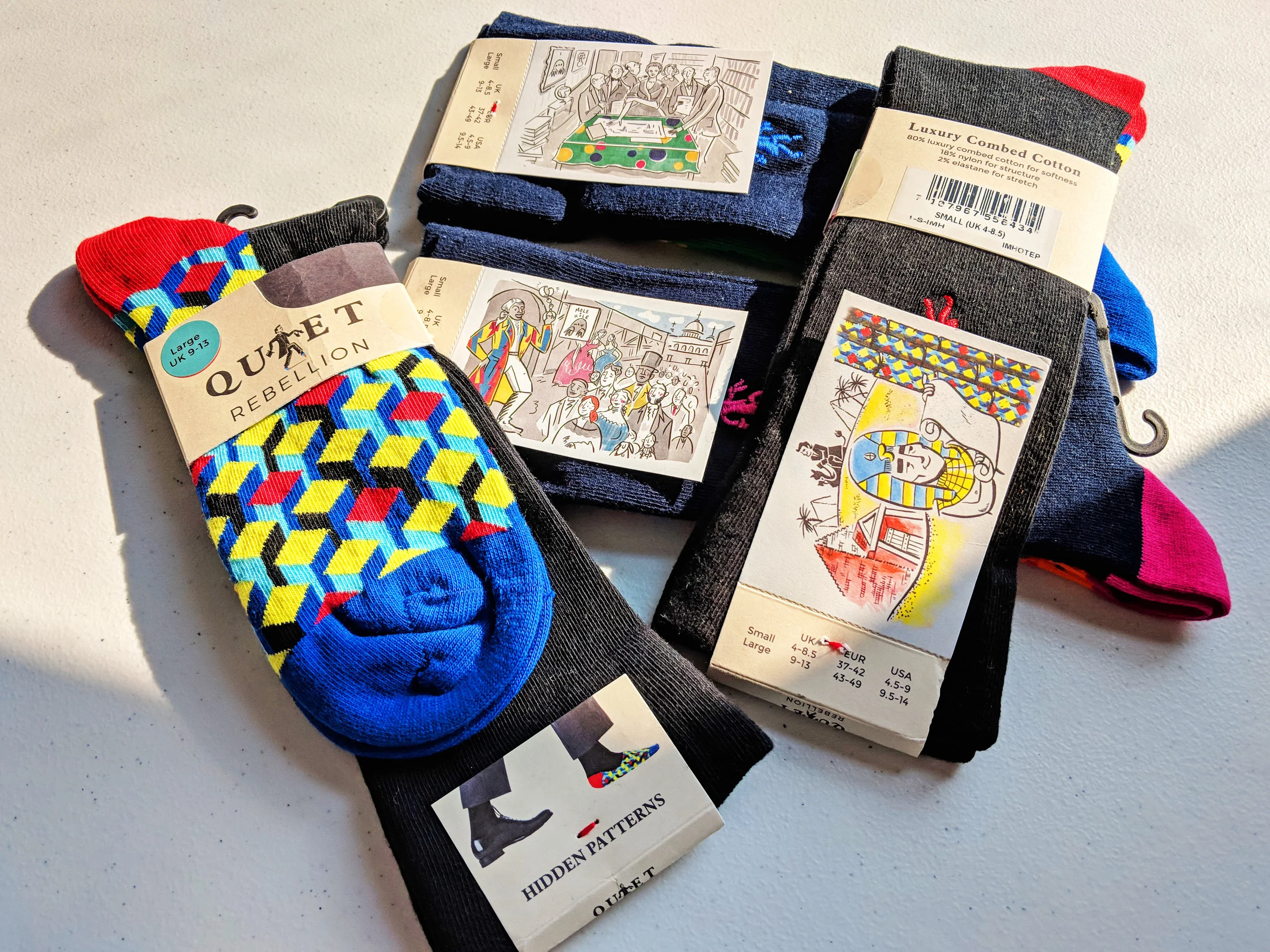 One detail we love is how each pair of socks and different design, has a different historical figure on the back; the illustrations are superb and let you in to the story of the inspiration for the design. You can pull off each illustration and keep it as a card; There's a story on the back, check it out! Photo Credit: The Sock Review