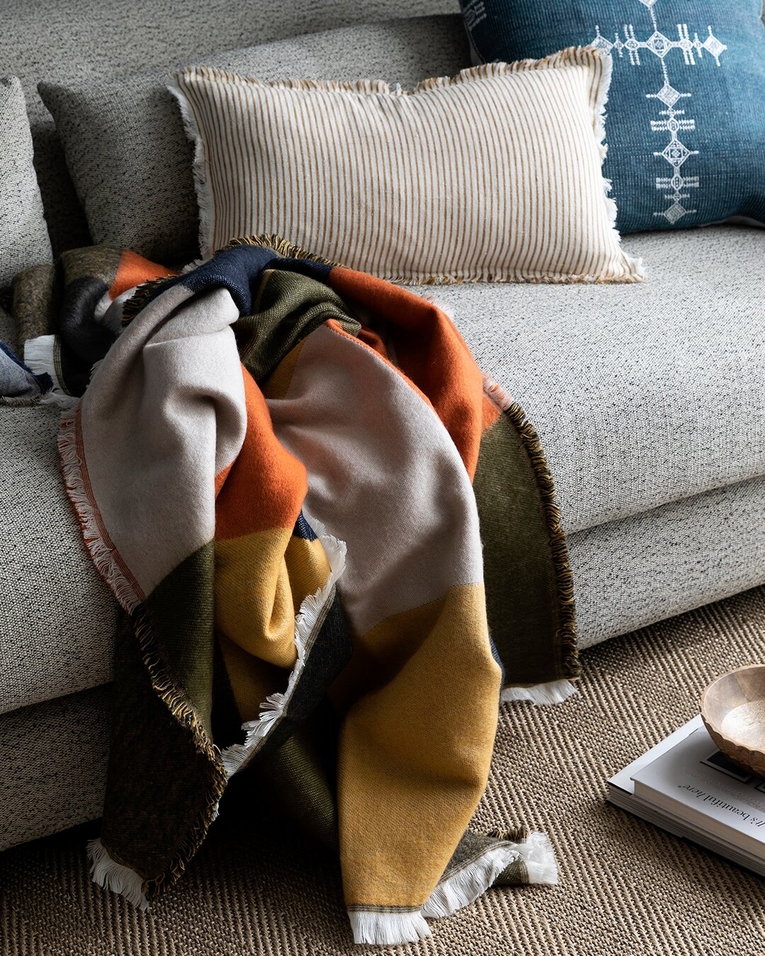 🧡 Elevate your living room essentials with The Lodge Throw &ndash; crafted from soft tweed material, adorned with large checks in sunset orange, khaki, navy blue, and natural tones, finished with intricate stitching for added charm.

Discover over 3