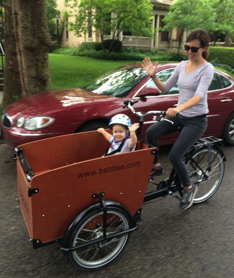 Emily riding with her young daughter.