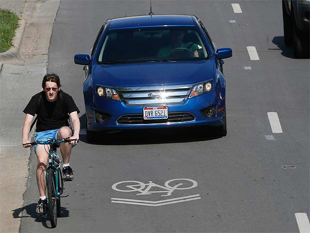 Point taken: a cyclist who clearly does not understand what that sharrow is for (i.e., to help him position himself correctly in the lane). Source: dispatch.com . 