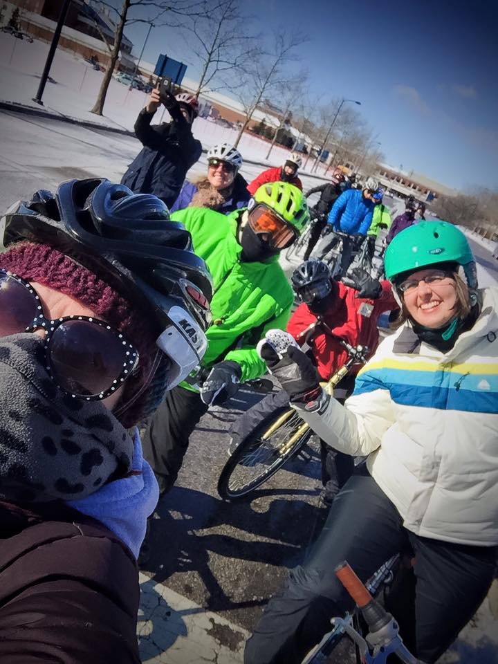 Ride Leader Jen Cowley (in the saucy teal helmet) with a pack of intrepid cyclists. Photo credit: Kathleen O'Dowd