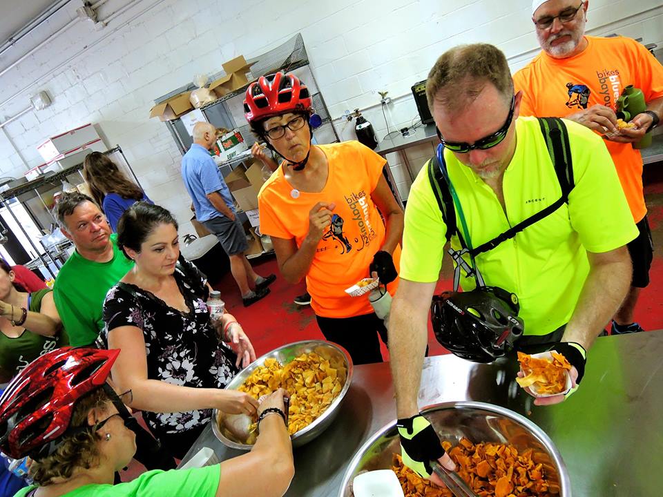 Cyclists sample some delicious OH! Chips during a stop on the ride. Photo credit: Bryan Barr