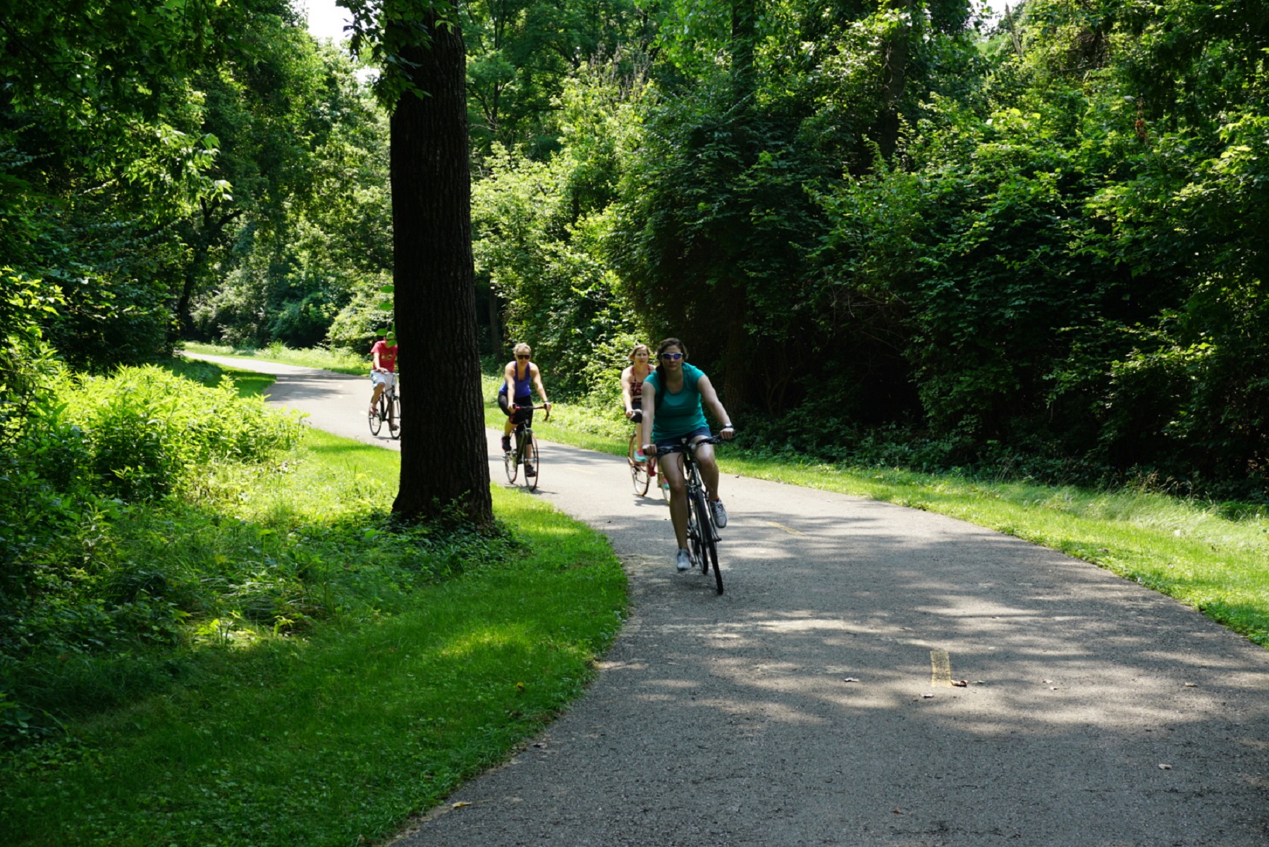 Cyclists ride a greenways trail. Photo source: planning-next.com 
