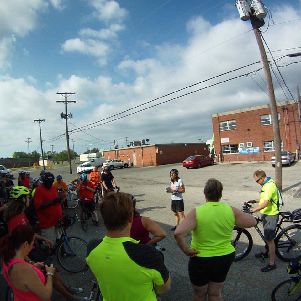 Ride leader Kathleen Koechlin talks with the group about the resilience of Somali refugees. Photo credit: Darrell McGrath