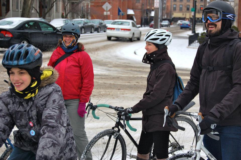 Gloria's oldest (lower left) rode his own bike on super slushly streets during his first Year of Yay! ride.