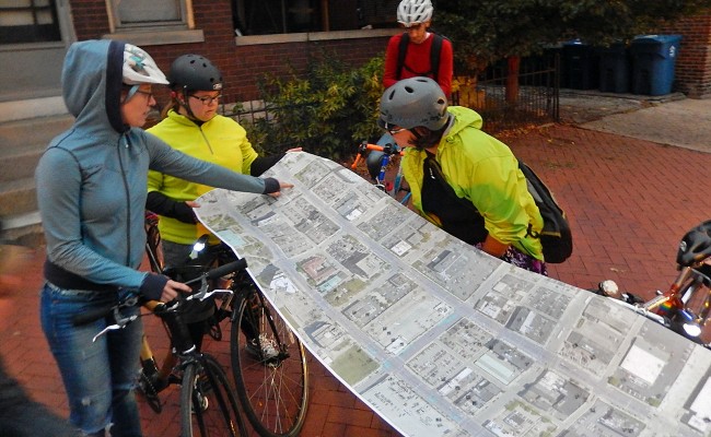 Rahel, center, reviewing a map of proposed changes to Downtown Columbus' streetscape. 