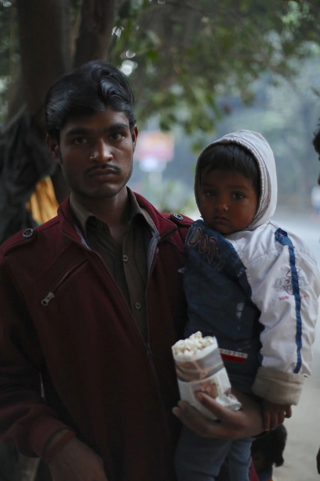 I don't think that this man & his baby were from the slums but he saw what we were doing and got some gifts too.