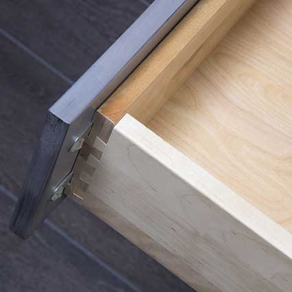 Dovetail joints are interlocked, so they are stronger than pinned or doweled joints