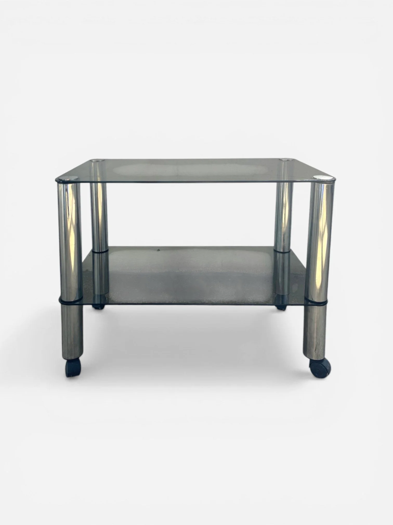 VINTAGE SMOKED GLASS AND CHROME ROLLING SIDE TABLE
