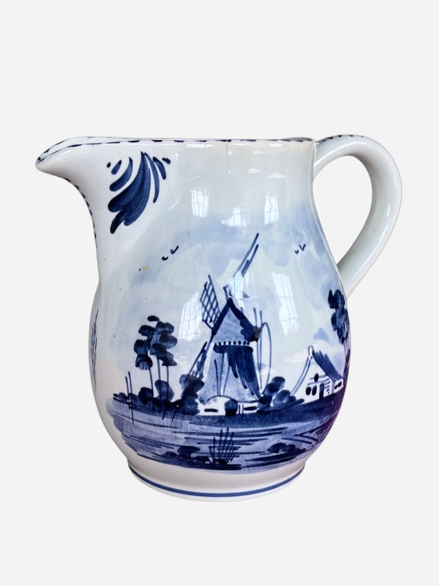 BLUE AND WHITE PAINTED CERAMIC PITCHER