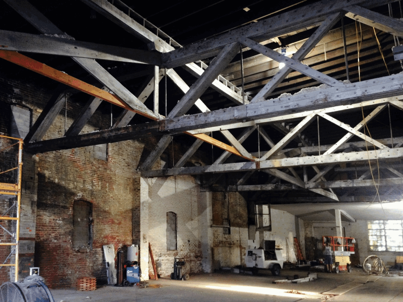 Gallery 1516 before and after renovations. From a livery stable in 1883, to a world-class exhibition space for Nebraska and regional artists.