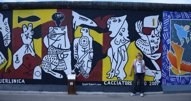 Egos put up walls between us. The Arts break them down. (Me at The Berlin Wall)
