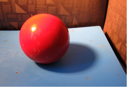 Ball with light/shadow pattern.