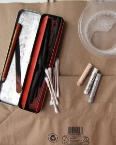 Cheap Supplies: Tin of charcoal, Q-tips, 3 pastels for painting light, tub of bleach.