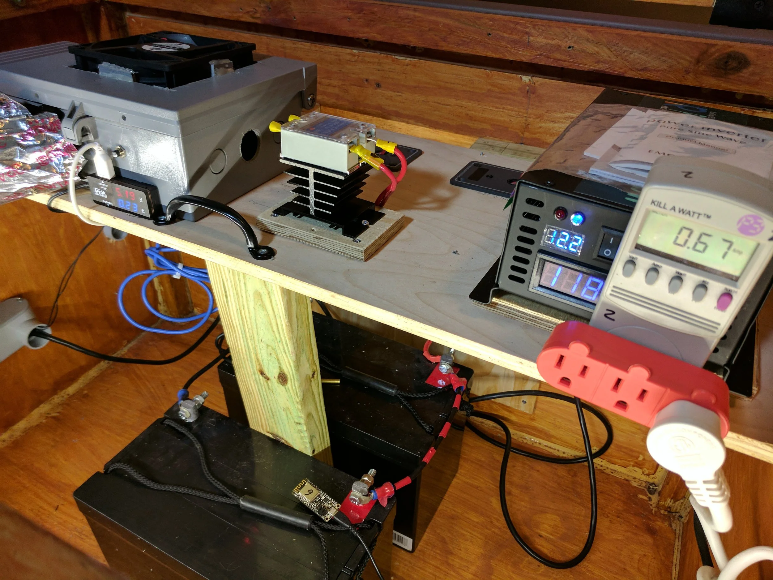 Close up of the batteries, DC to AC inverter, and solid state relay that controls power to the inverter.