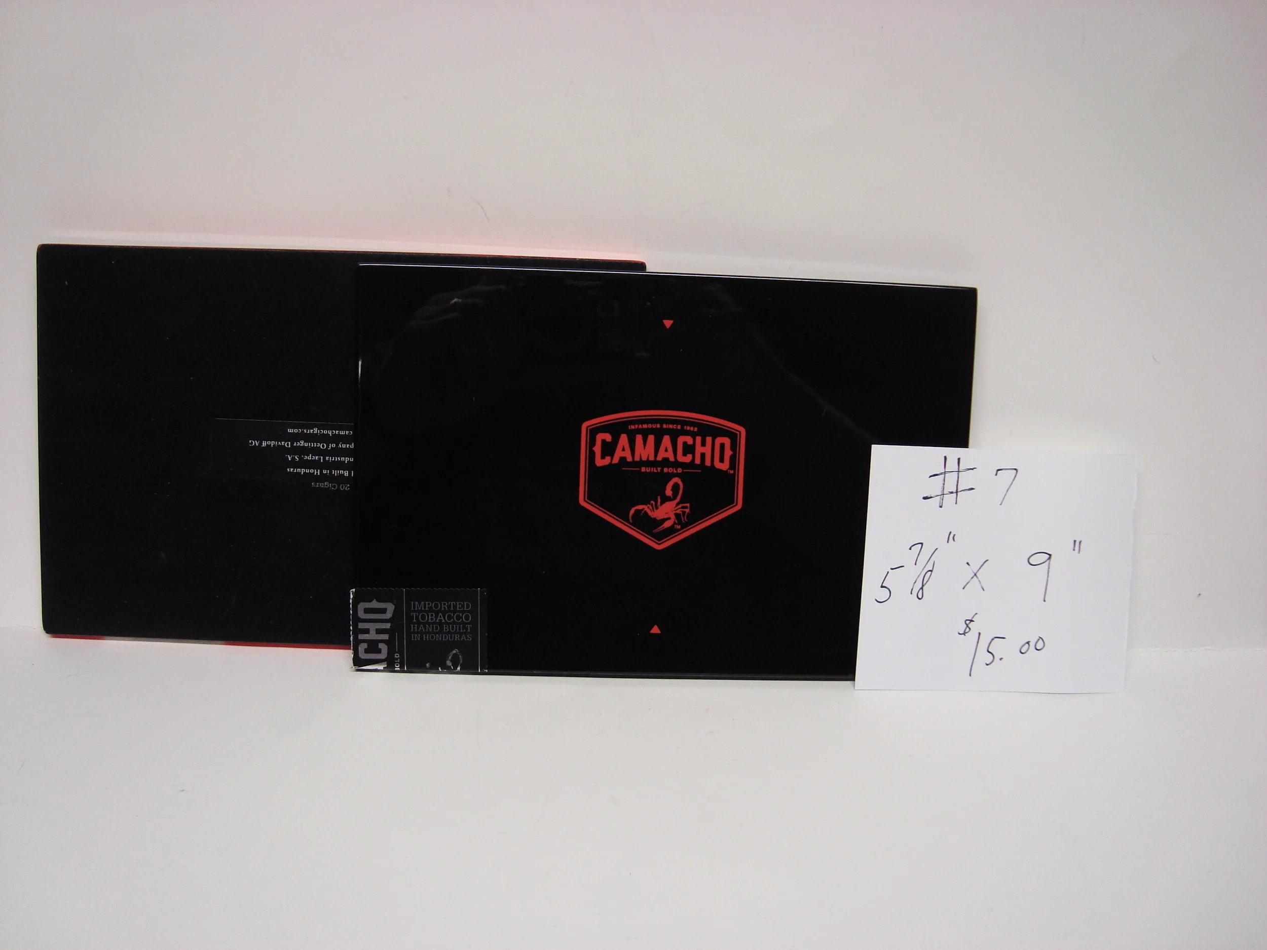 Front cover has a nice black piano lacquer finish. The back cover is covered in felt. Four Stations