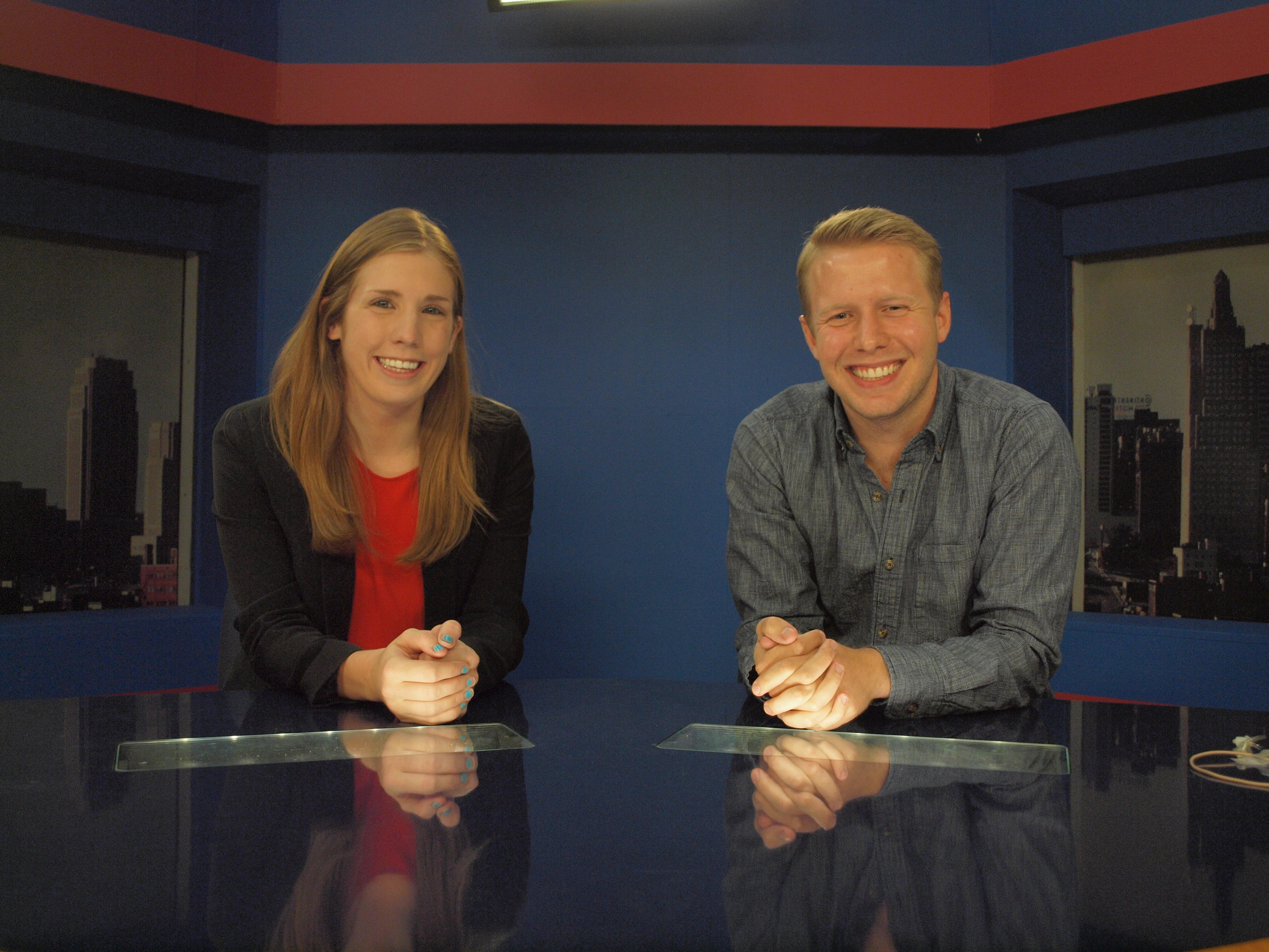 Seniors Cailey Taylor and Harrison Drake on the KUJH-TV set.