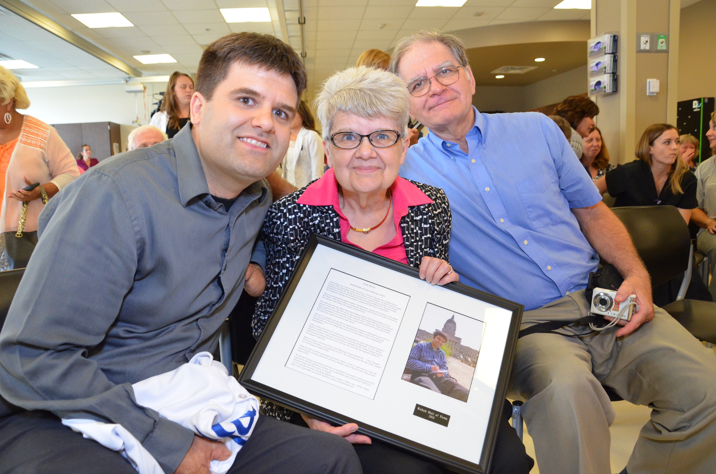 Andy Marso (left) with his parents at his Rehab Hall of Fame induction.