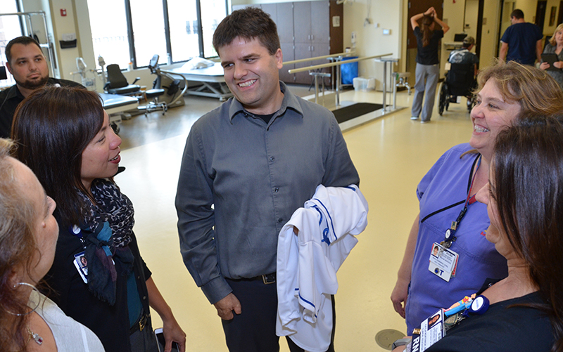 Andy Marso (center) visits with KU Hospital staff.