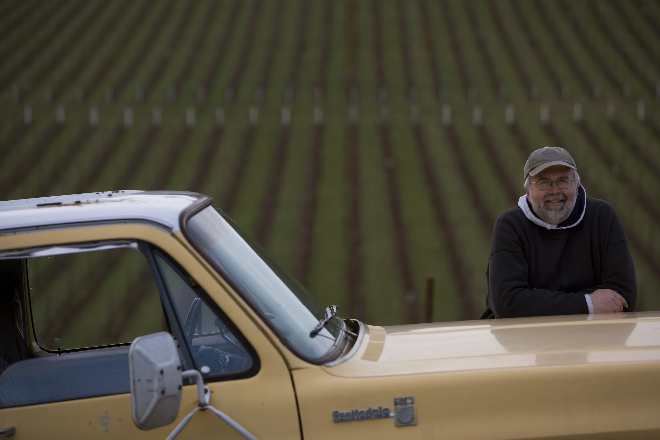 “I get that same creative charger from winemaking that I do from reporting and writing," says Jerry Sass, who owns and operates Sass Winery in Salem, Oregon. Sass received his master's degree from the William Allen White School of Journalism and Mass Communications in 1984. Photos of Sass Winery courtesy of Brian Lehmann