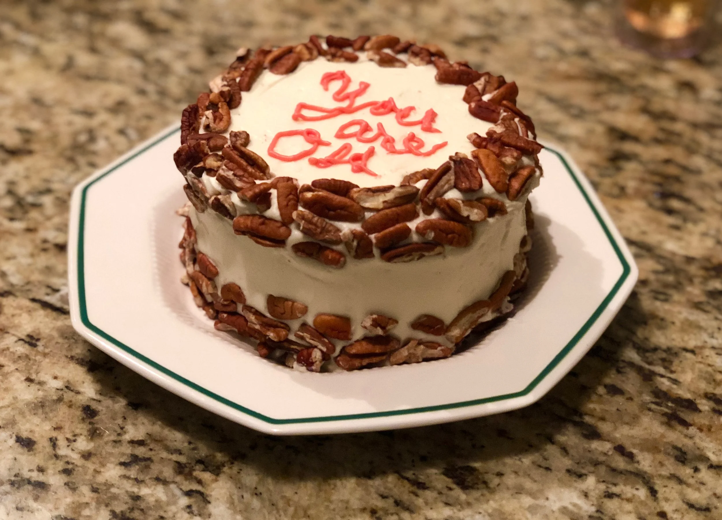Please do not fault the baker’s frosting writing skills. She tried.
