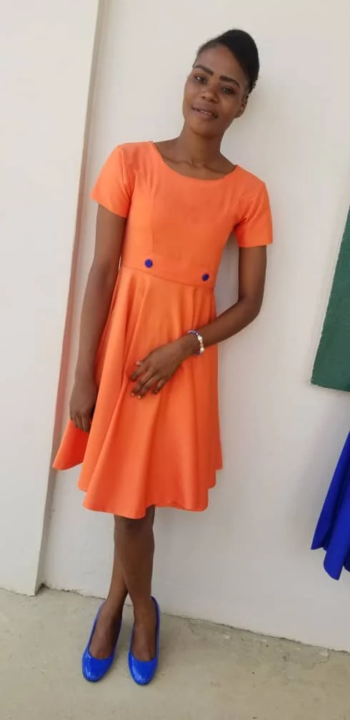 Manoucheka_orange_dress.jpg