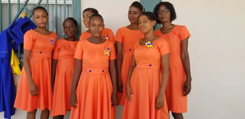 Women_students_orange_dresses.jpg