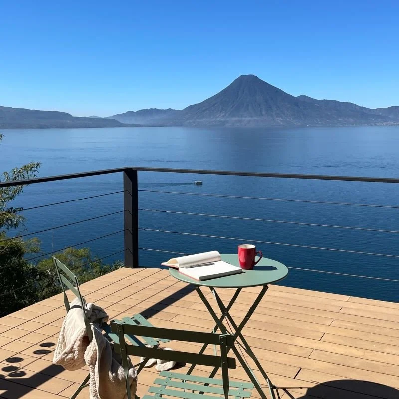Morning journal time on a guesthouse balcony over Lake Atitlan