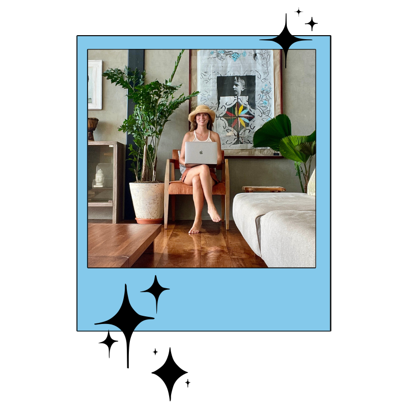 Christina working remotely in a tropical bungalow