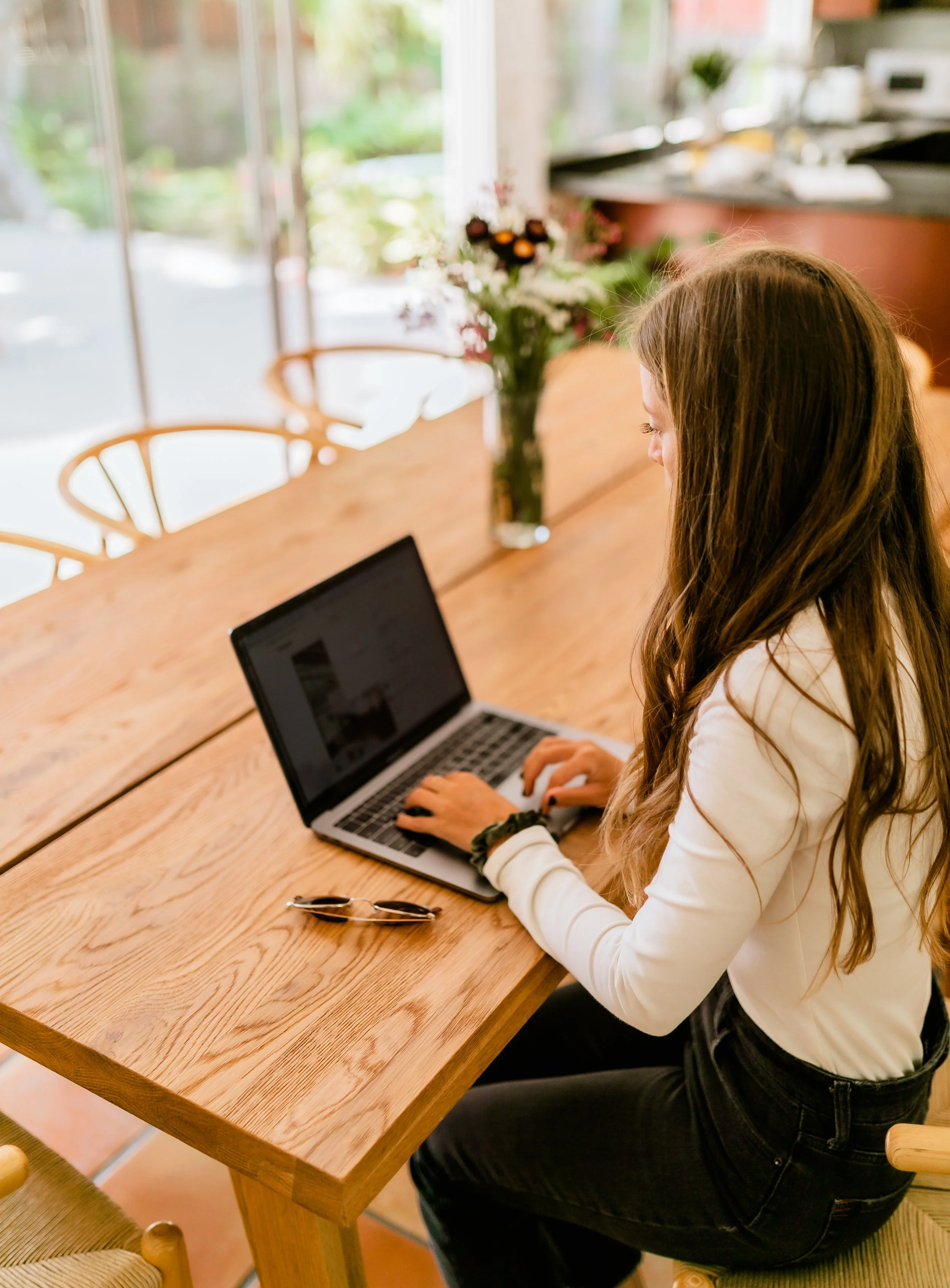 Christina Wiese working on laptop in California
