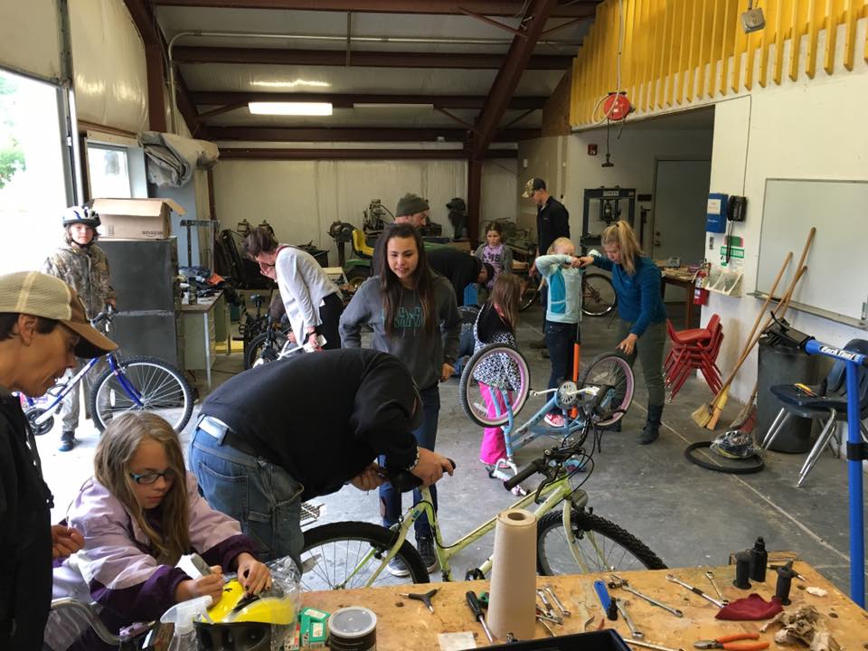 A shot of all of the tune-up action. This storage space that Dixon elementary had worked out very well for spreading out people, bikes, and tools. We provided the school with all the proper tools and a bike stand and from now on the kids can come in and maintain their bikes in this space.