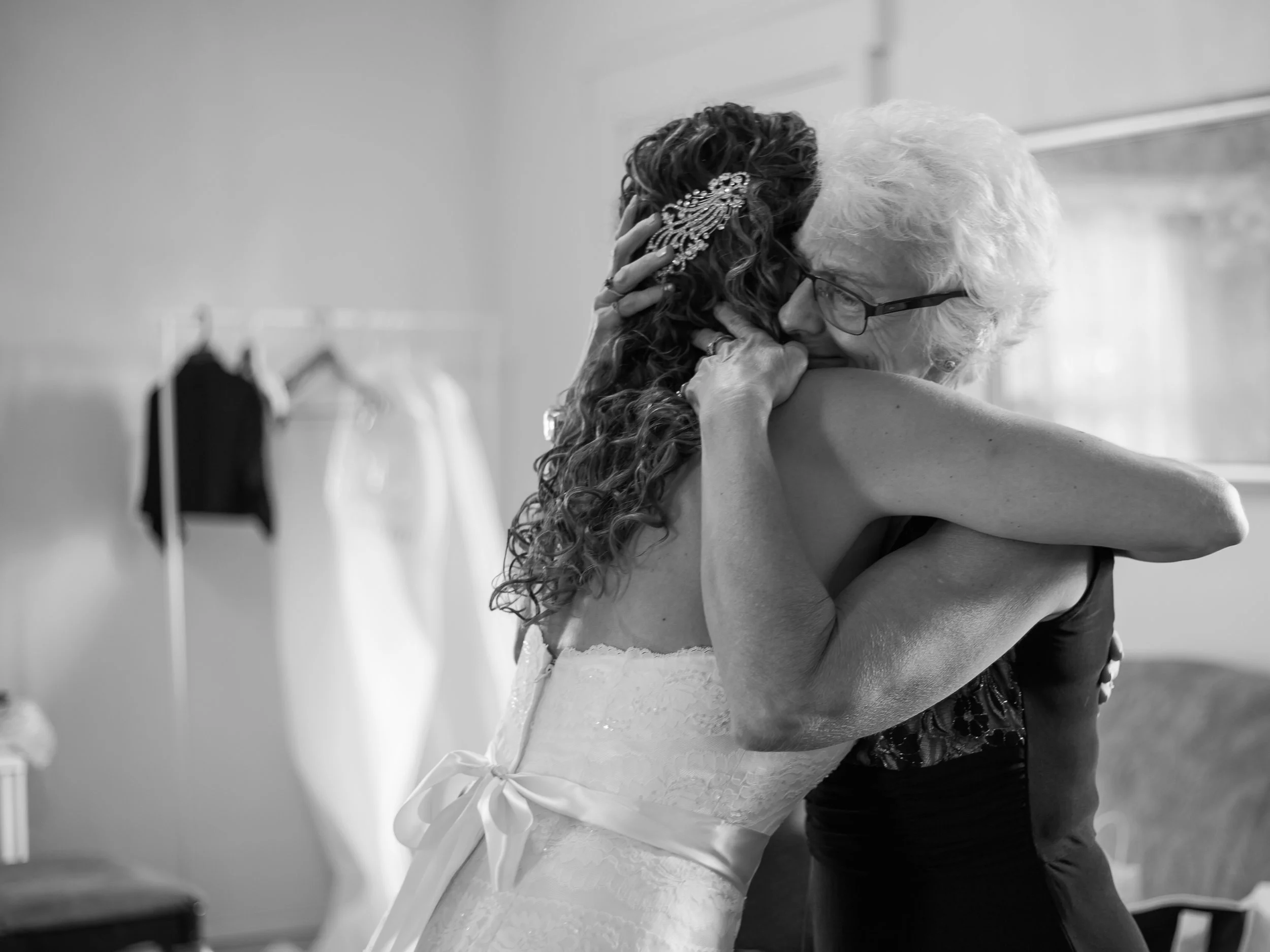 Bride embraces her mother before the wedding ceremony. © Merry Ohler Creative, 2019. Photo by Merry Ohler, Wedding Photographer Kansas City.