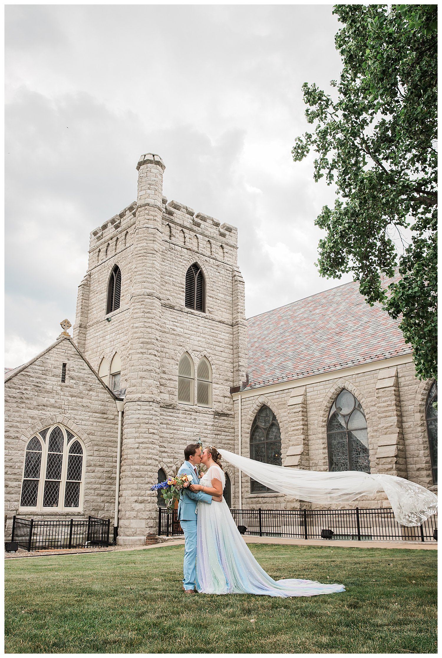 Bride and Groom embrace near church in Kansas City.