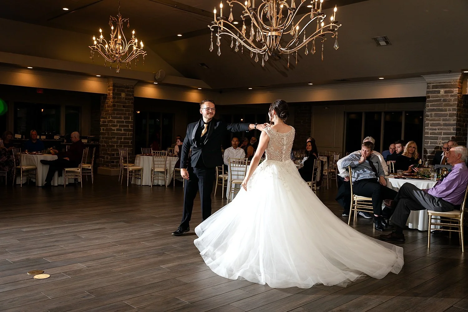 Bride and groom dance during reception at Cole's Garden in Oklahoma City, OK.