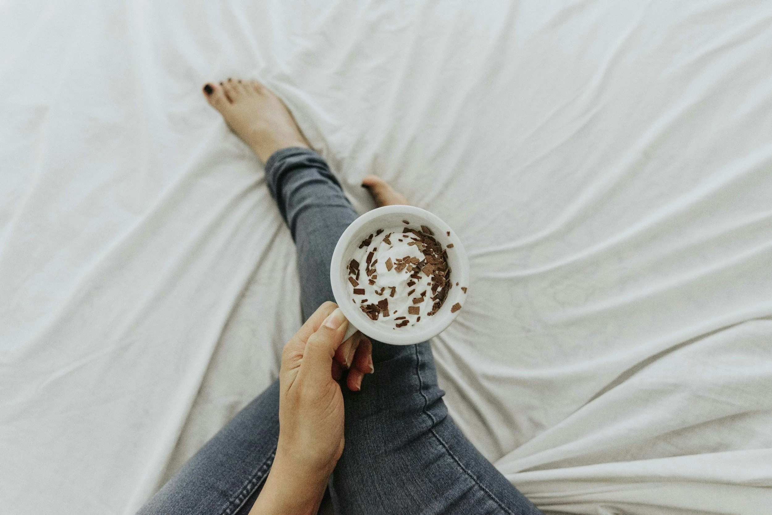 Mother holds a mug of hot chocolate in Kansas City.