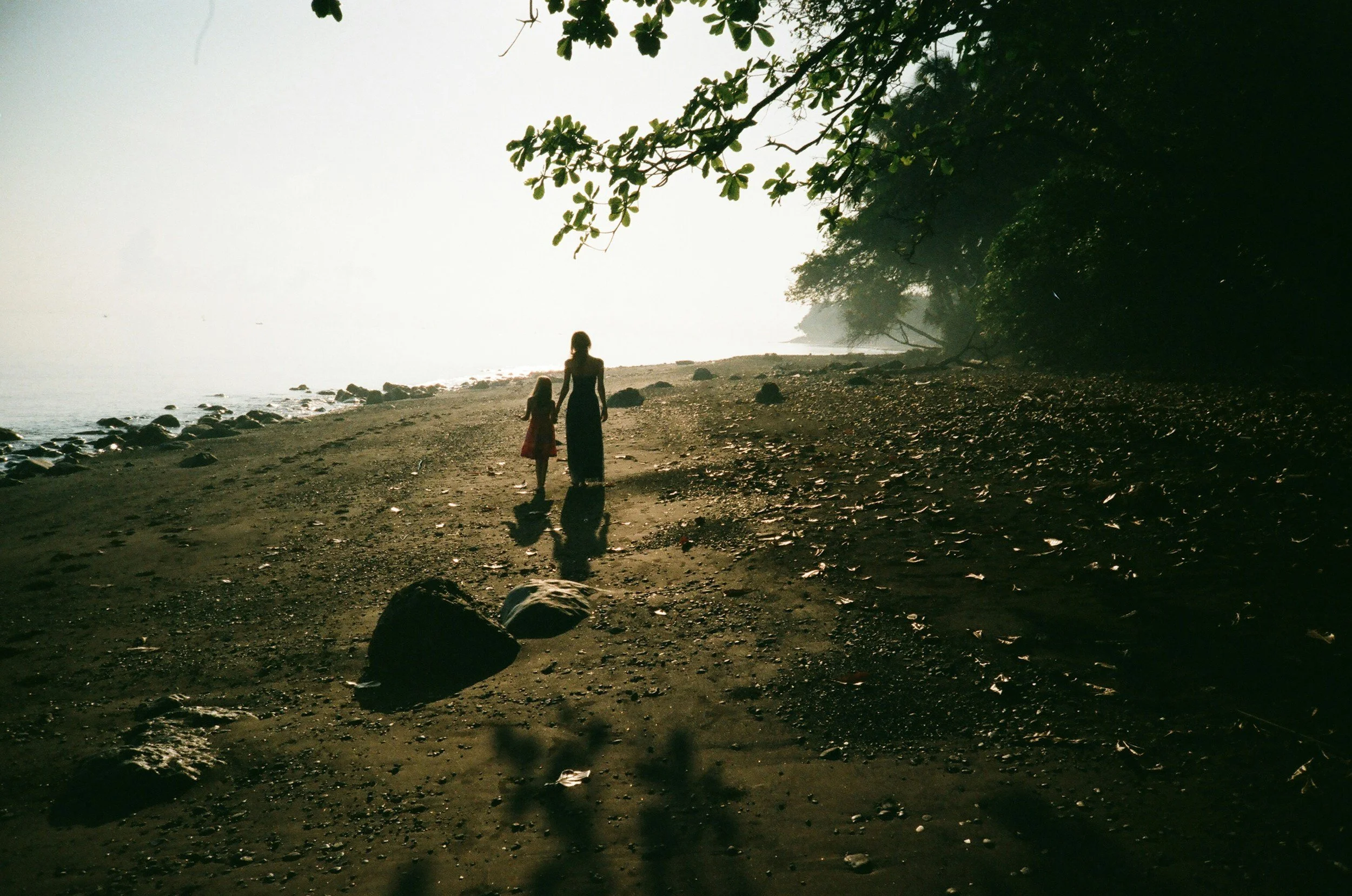 Mother and daughter walking by lake in Kansas City.