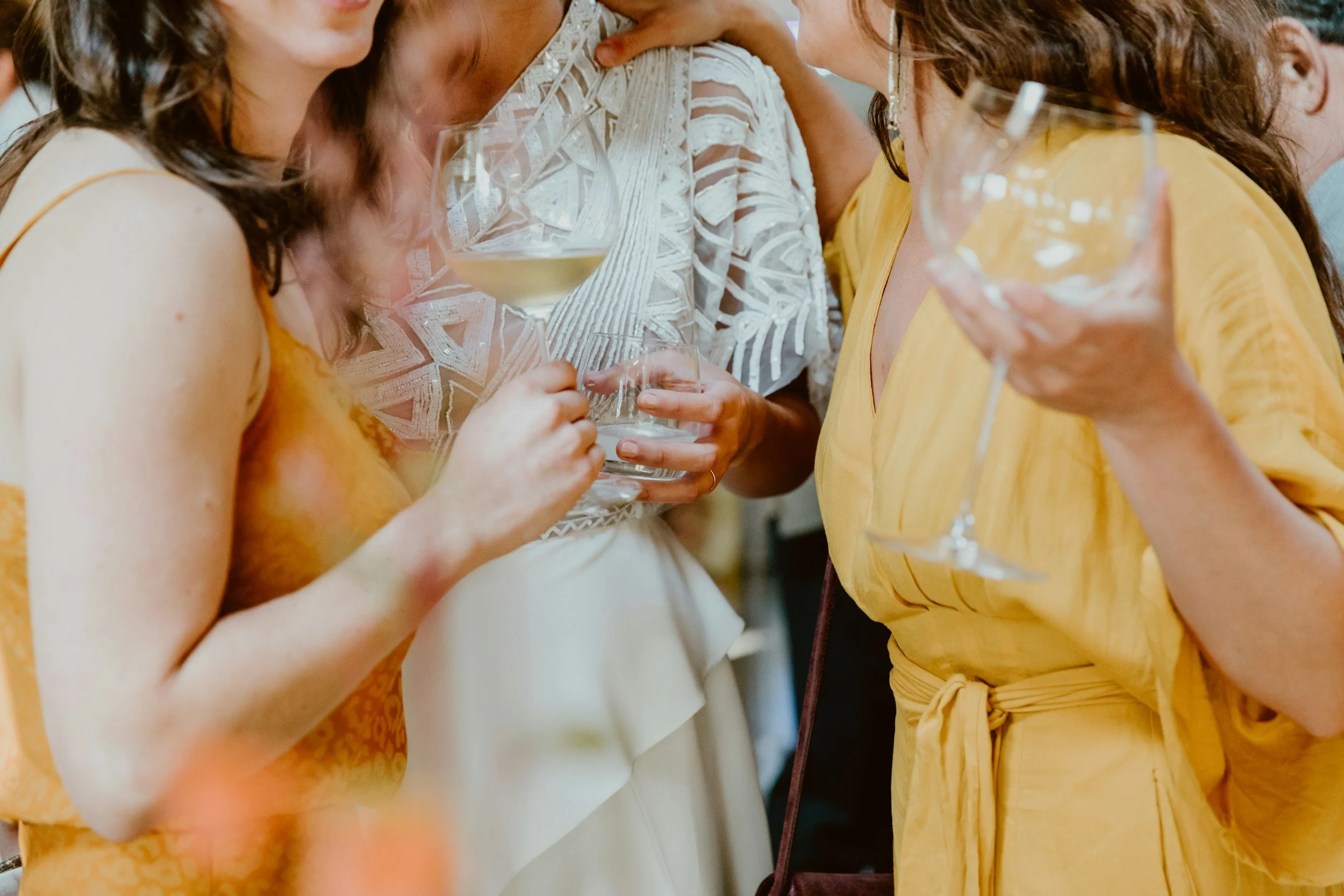 Candid cocktail hour photos at a Kansas City wedding, guests enjoying drinks and conversation before the reception.