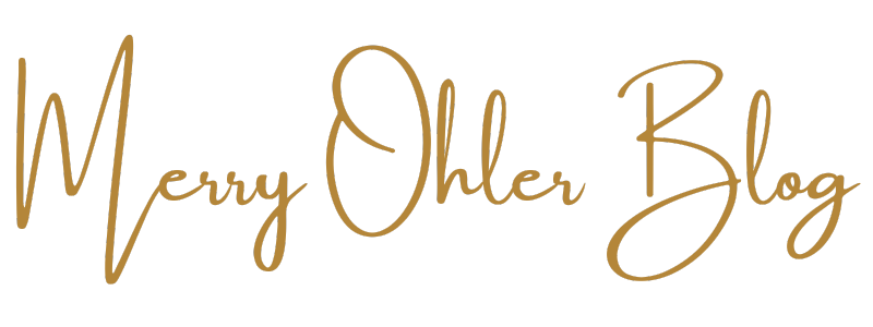 Text saying 'Merry Ohler Blog' in gold cursive font on a black background in Kansas City.