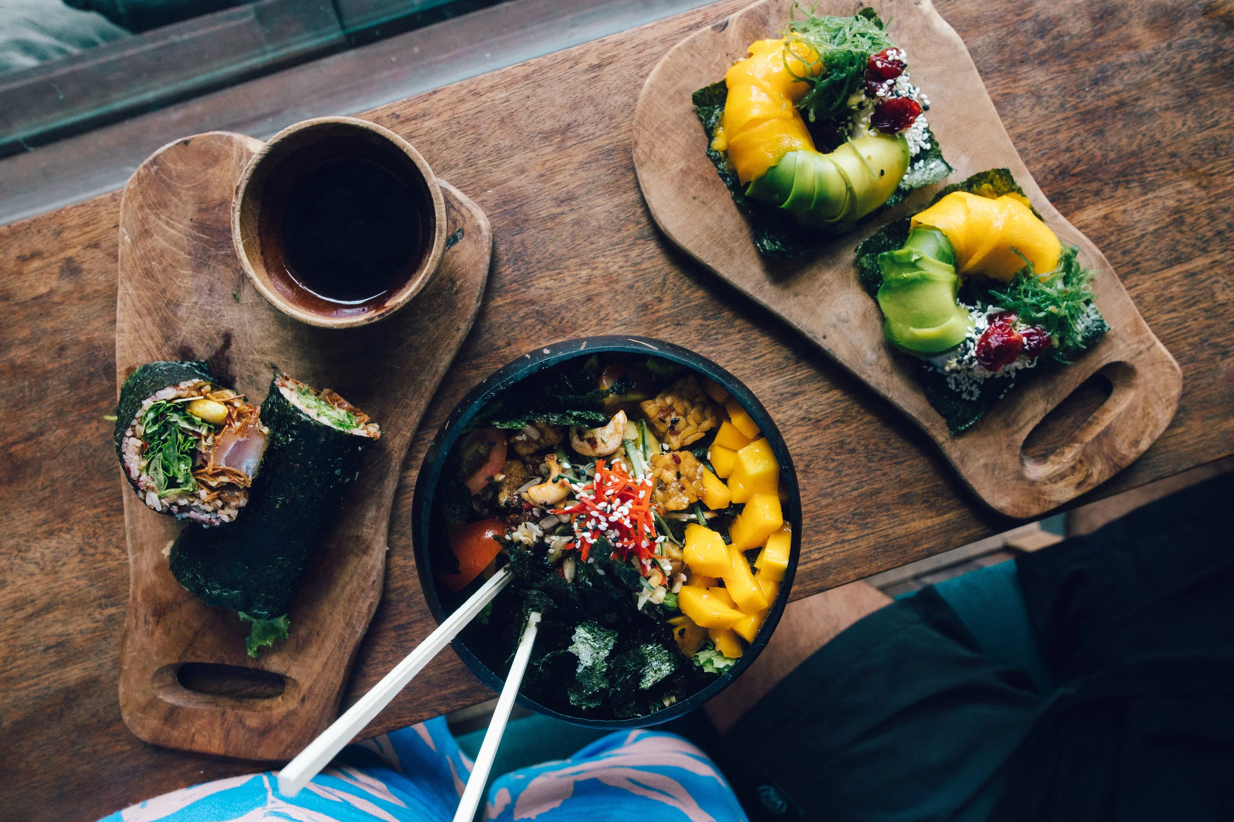 My favourite poke bowl (centre), vegetarian poke bowl with sesame crusted tempeh, mango and nori sheets. On the left is Alex's poke burrito with tuna and on the right some vegetarian poke donuts. 