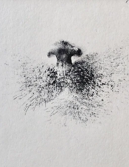 Black ink nose print on white paper