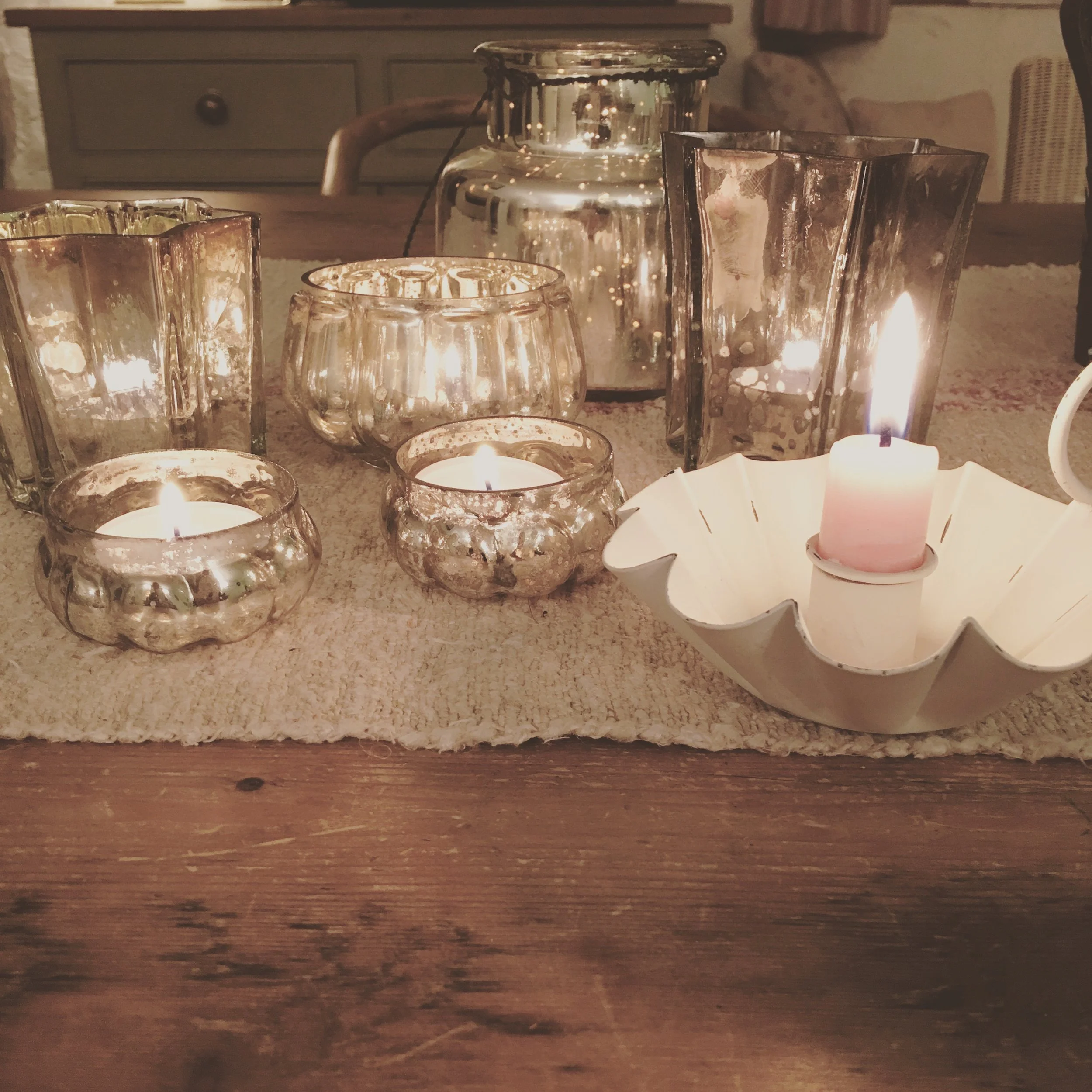 Pretty silvered glass votives and distressed metal chamber sticks coming to the brocante.