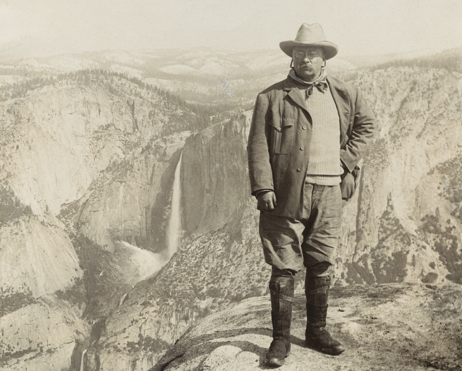 Pictured here at Yosemite National Park, Theodore Roosevelt is an individual who stood his ground against the tide of unchecked industrialization in the United States. Not avidly against or avidly in favor, he instead chose to make his own political decisions largely divorced from the realm of corporate interest. Photographic portraits of Roosevelt are sometimes confusing in how variant they are; for every photo of him orating in a suit, there is another of him striking a stoic pose in the thick of the wilderness.